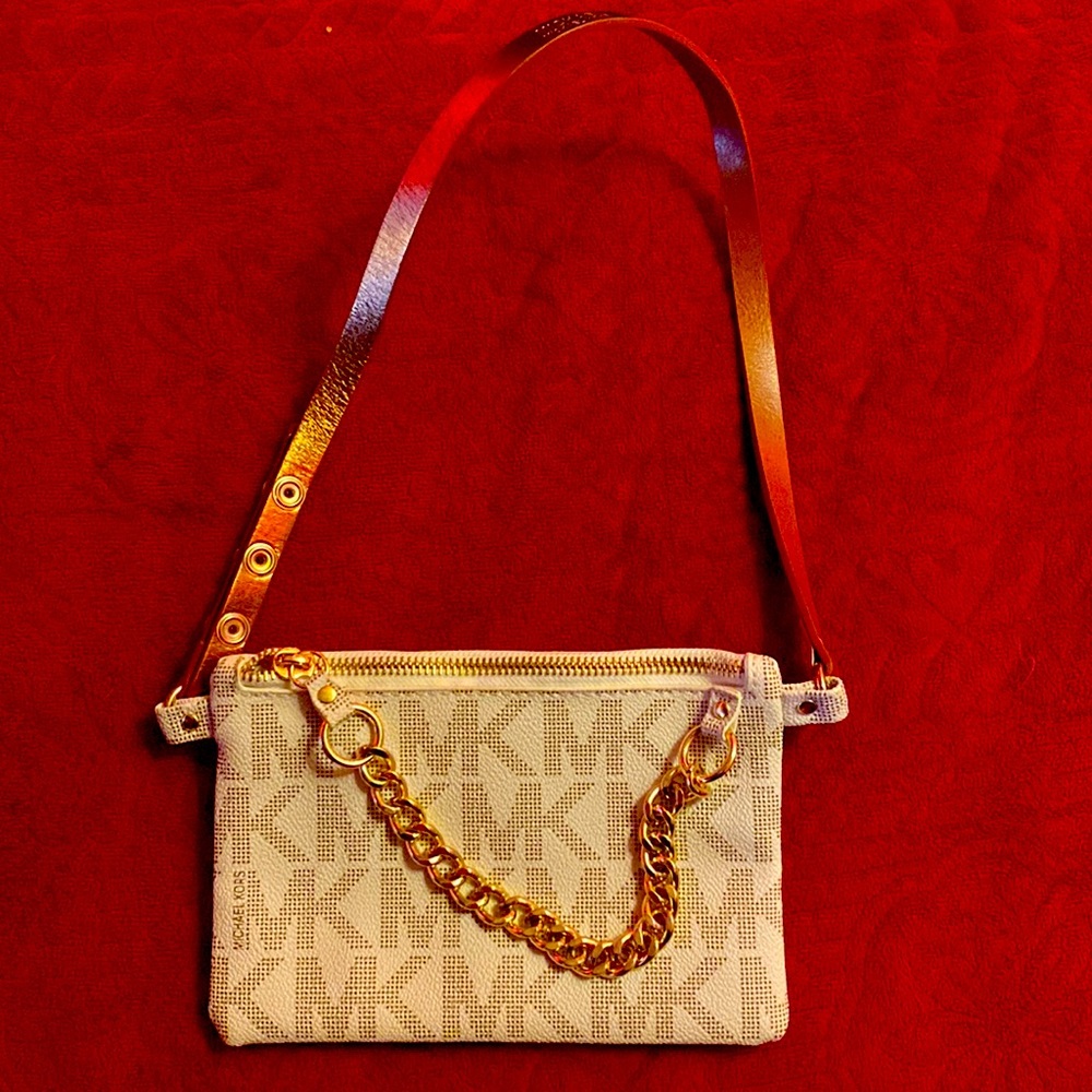 Never used. Small wallet sized MK bag with adjustable strap and gold chain